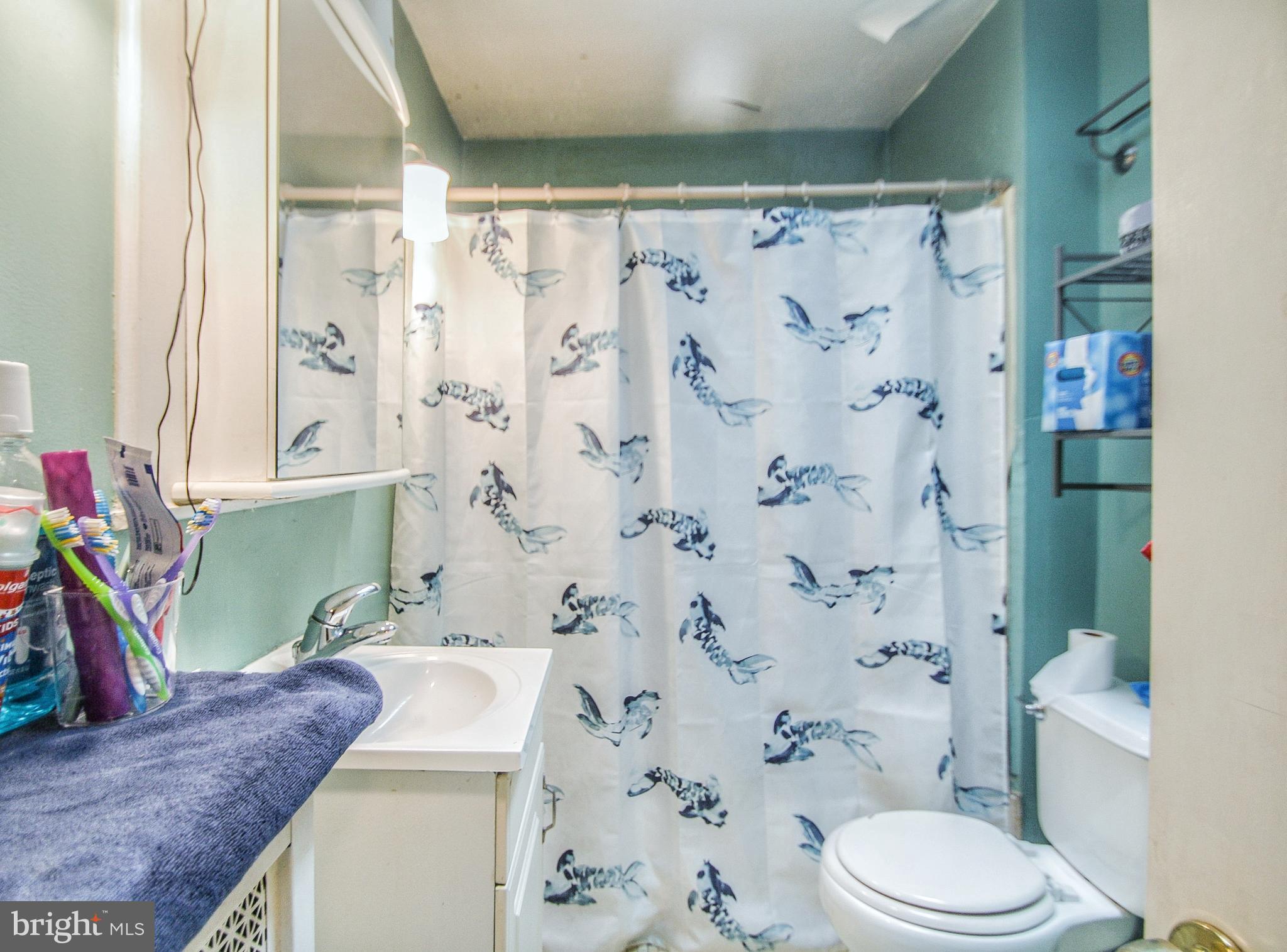 246 Coverly Road Lansdowne, PA 19050 - Photo 25 of 31 a bathroom with a granite countertop sink and a mirror