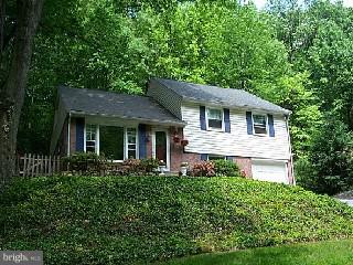 546 Brookwood Road Wayne, PA 19087 - Photo 1 of 6 a front view of a house with a garden