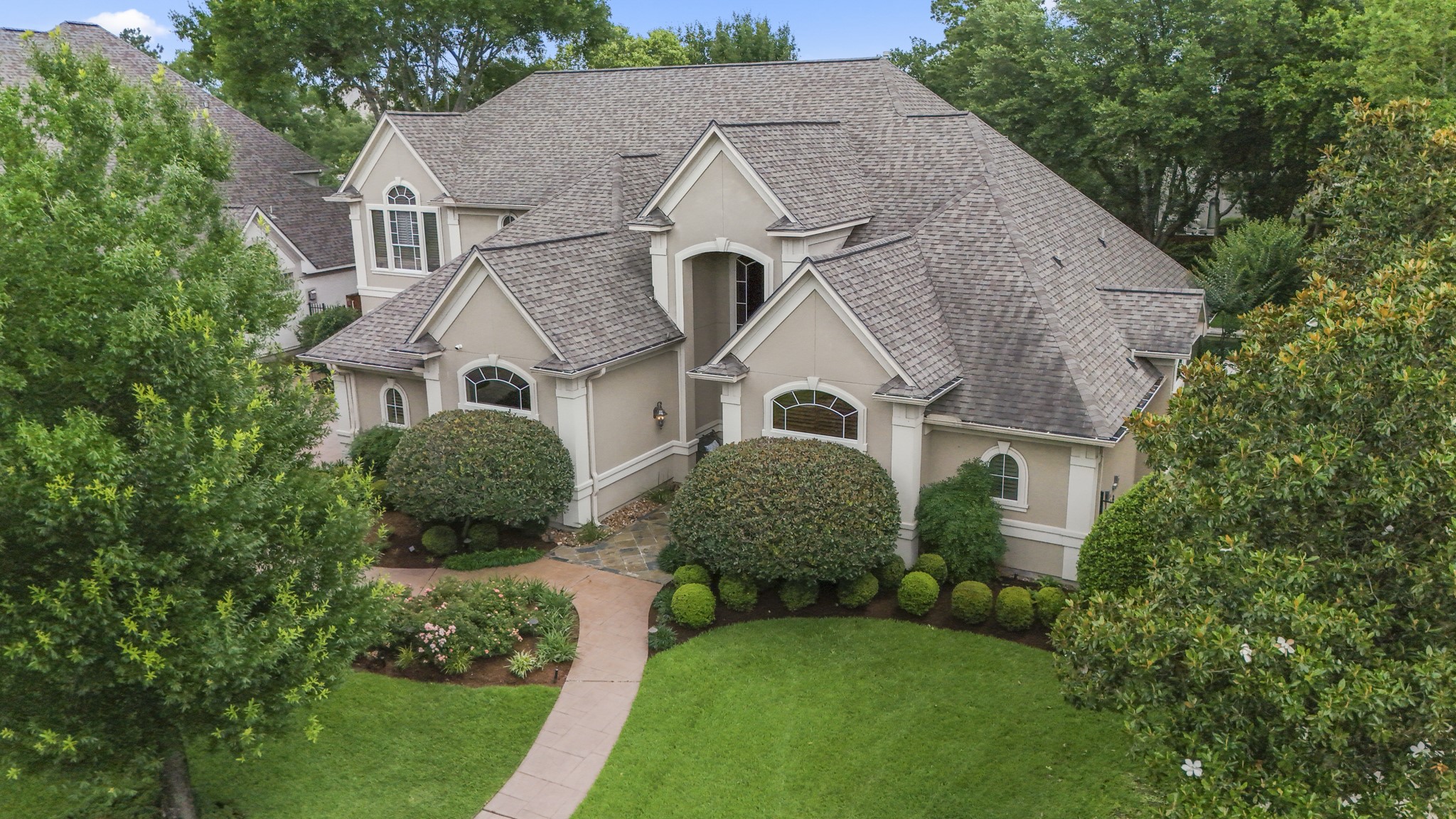 Stunning custom home in prestigious gated lake community.
