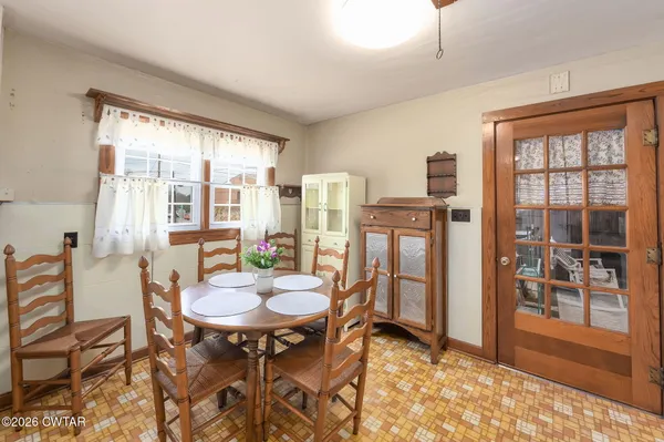a view of a dining room with furniture window and outside view