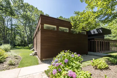 a backyard of a house with lots of green space
