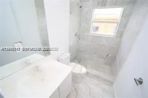a bathroom with a bathtub and shower