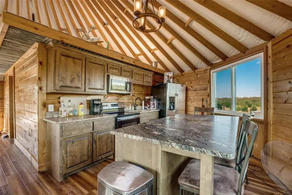 a kitchen with sink cabinets and outdoor space