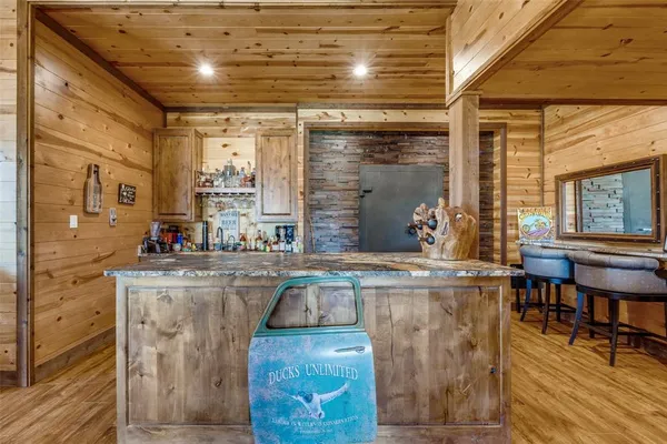 a kitchen with stainless steel appliances granite countertop a sink and cabinets