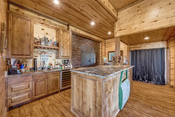 a kitchen with stainless steel appliances granite countertop a stove and cabinets