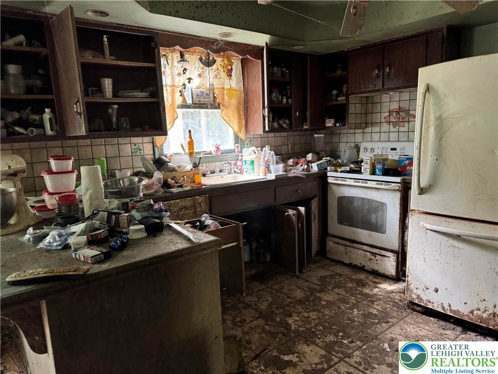 645 Long Mountain Road Effort, PA 18330 - Photo 5 of 5 a kitchen with a sink stove and refrigerator