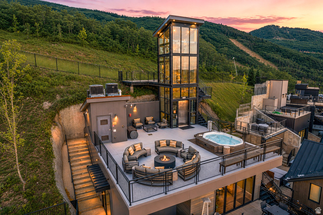 1258 Rothwell Road Park City, UT 84060 - Photo 37 of 48 Expansive rooftop deck featuring a built-in hot tub, fire pit, and ample lounge seating