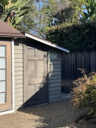 a back view of a house with a yard