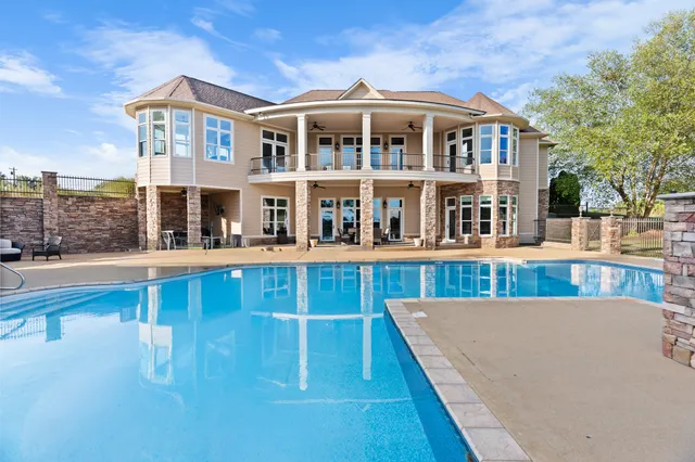 an aerial view of a house with garden space and street view