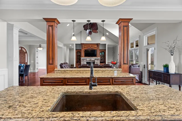 a kitchen with stainless steel appliances granite countertop a stove and cabinets