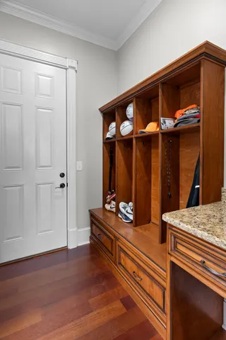 a bathroom with a granite countertop sink toilet a mirror and shower