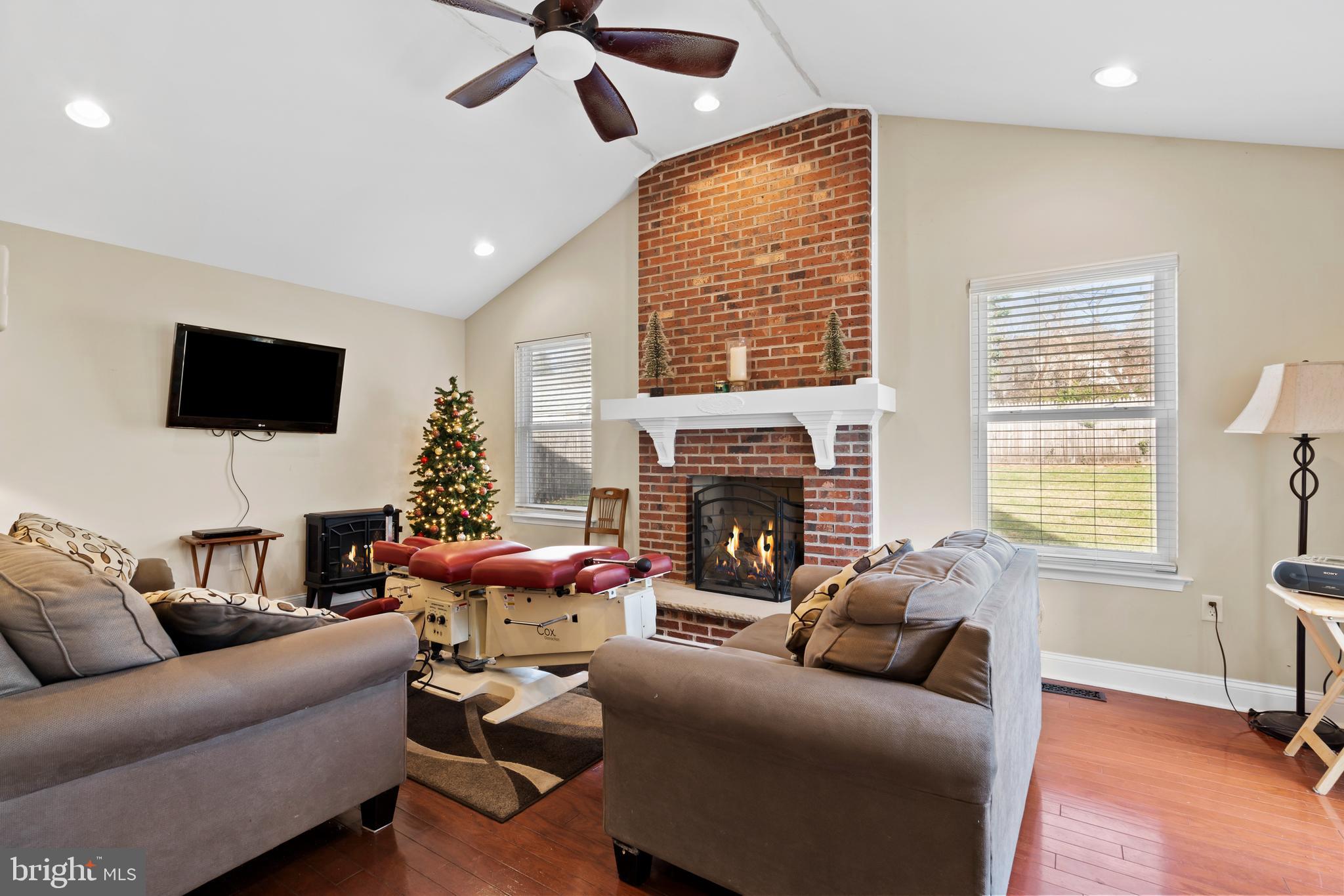 17 Alberts Way Langhorne, PA 19047 - Photo 13 of 35 a living room with furniture a flat screen tv and a fireplace