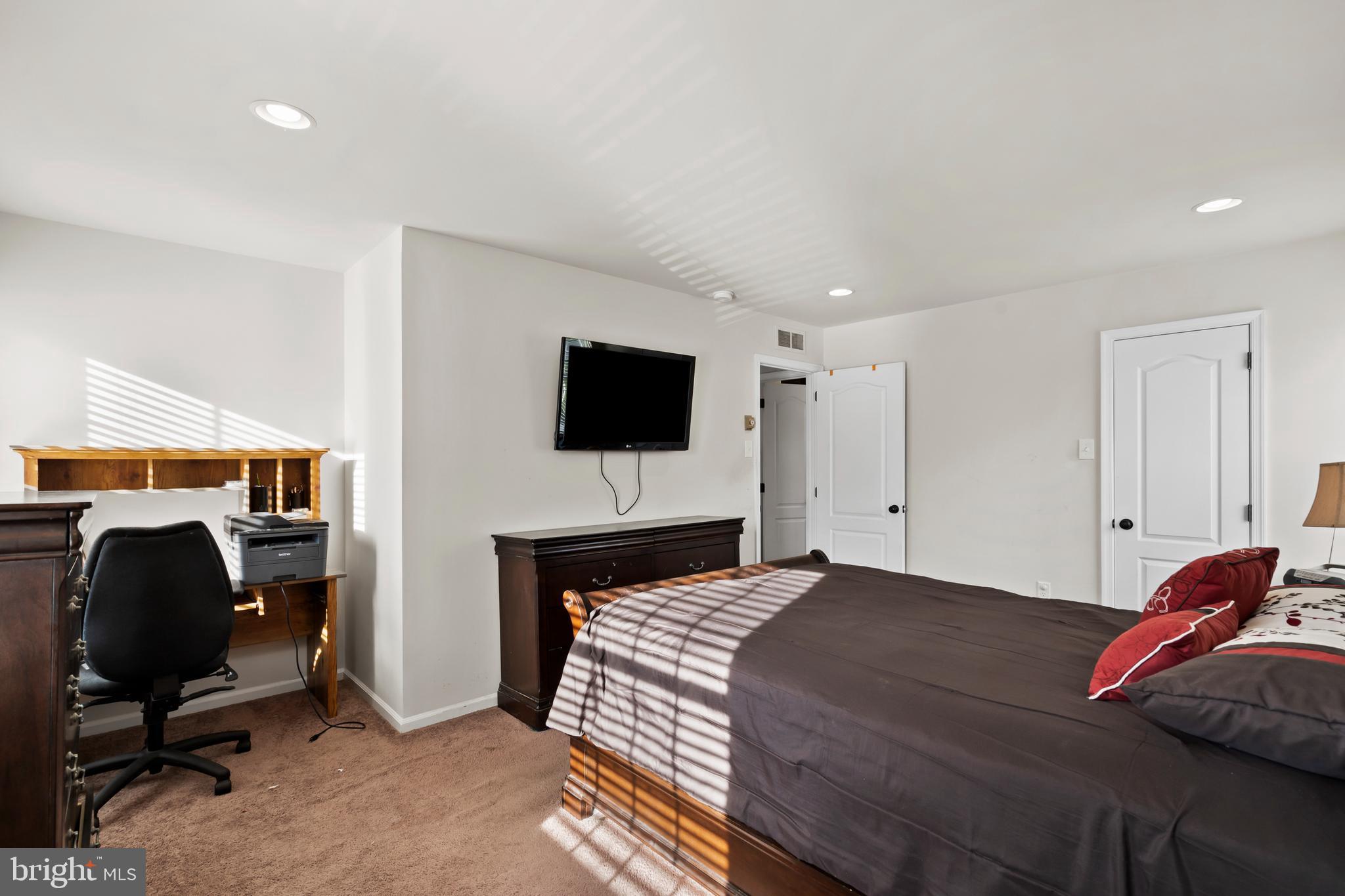 17 Alberts Way Langhorne, PA 19047 - Photo 19 of 35 a bedroom with a bed and a chair