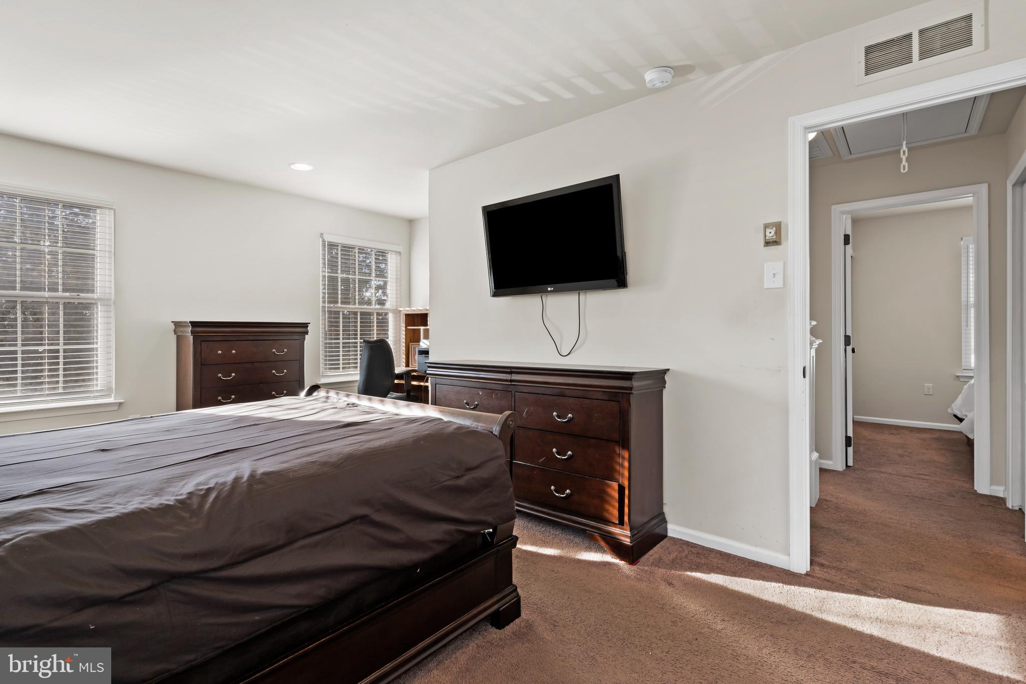 17 Alberts Way Langhorne, PA 19047 - Photo 20 of 35 a bedroom with a bed and a flat screen tv