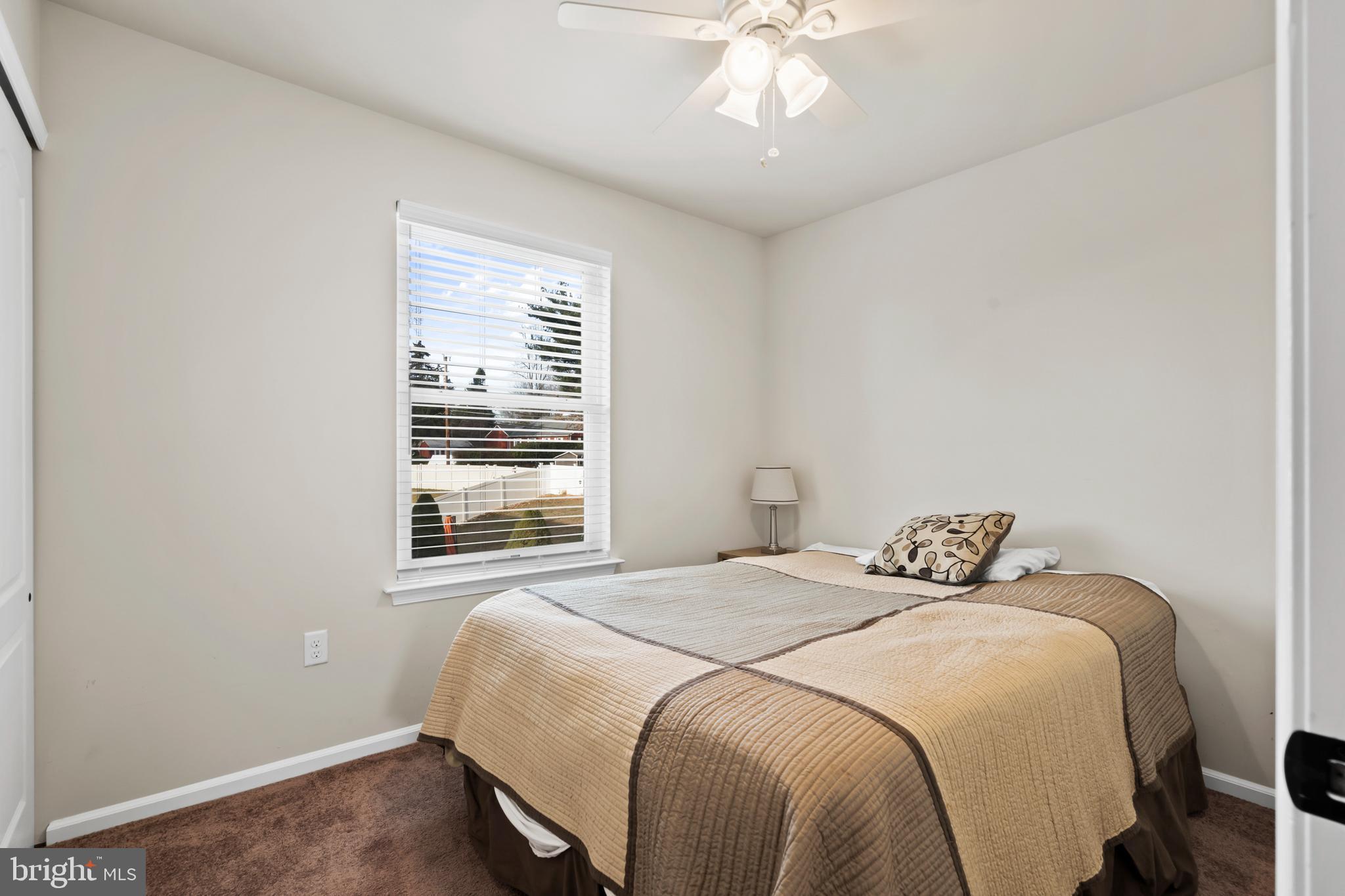 17 Alberts Way Langhorne, PA 19047 - Photo 25 of 35 a bedroom with a large bed and a chandelier