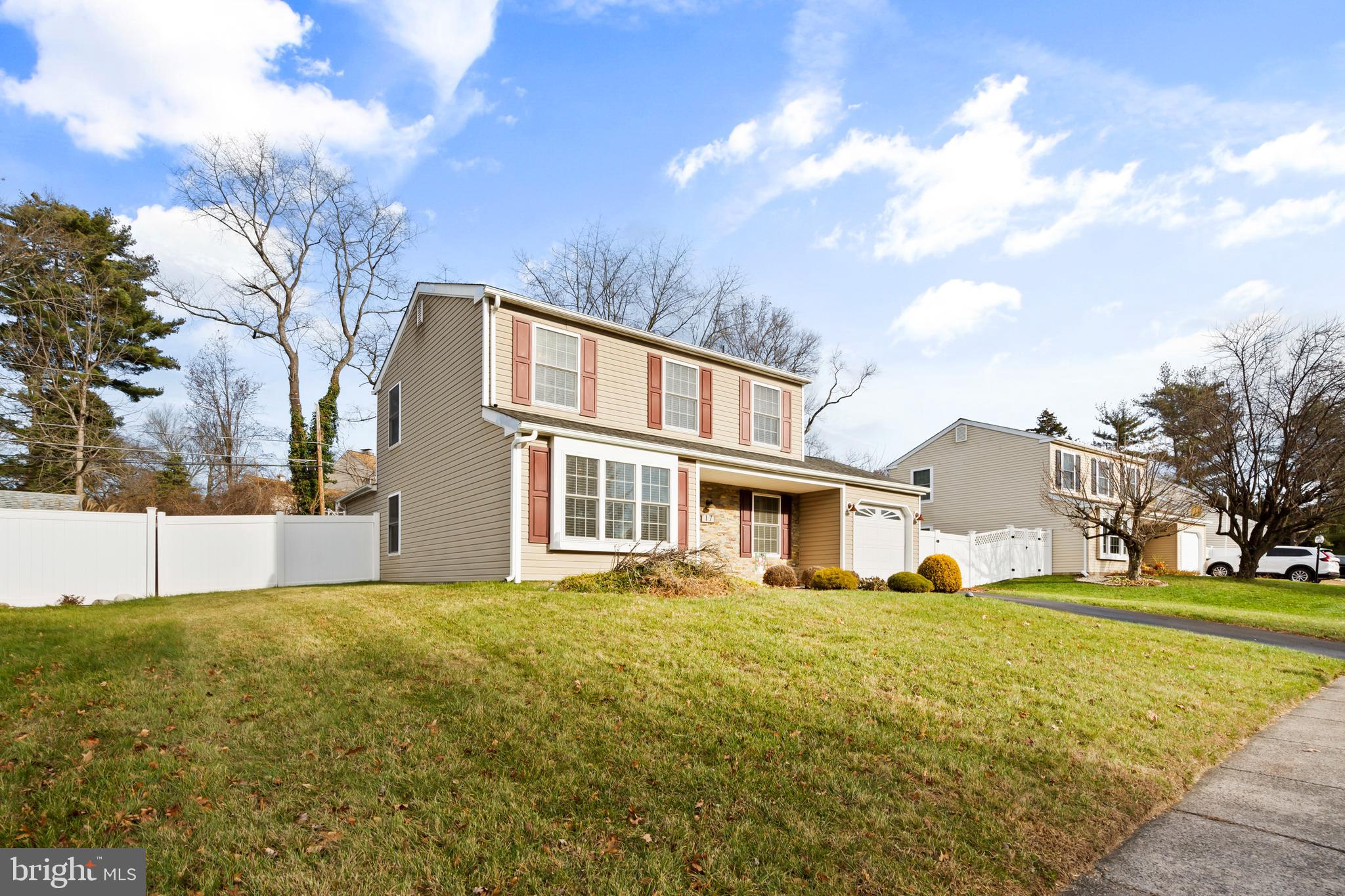 17 Alberts Way Langhorne, PA 19047 - Photo 3 of 35 a view of a white house with a big yard and large trees