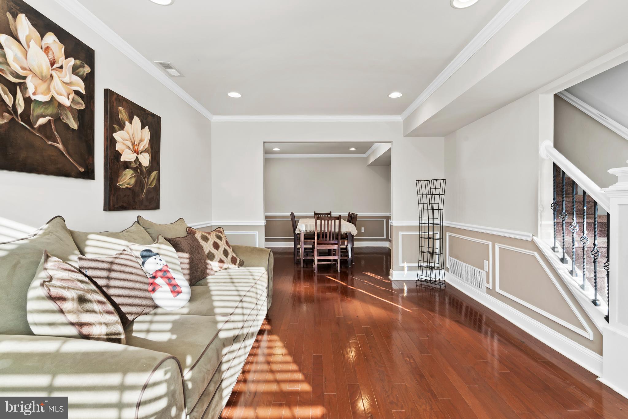 17 Alberts Way Langhorne, PA 19047 - Photo 5 of 35 a living room with furniture and a dining table with wooden floor