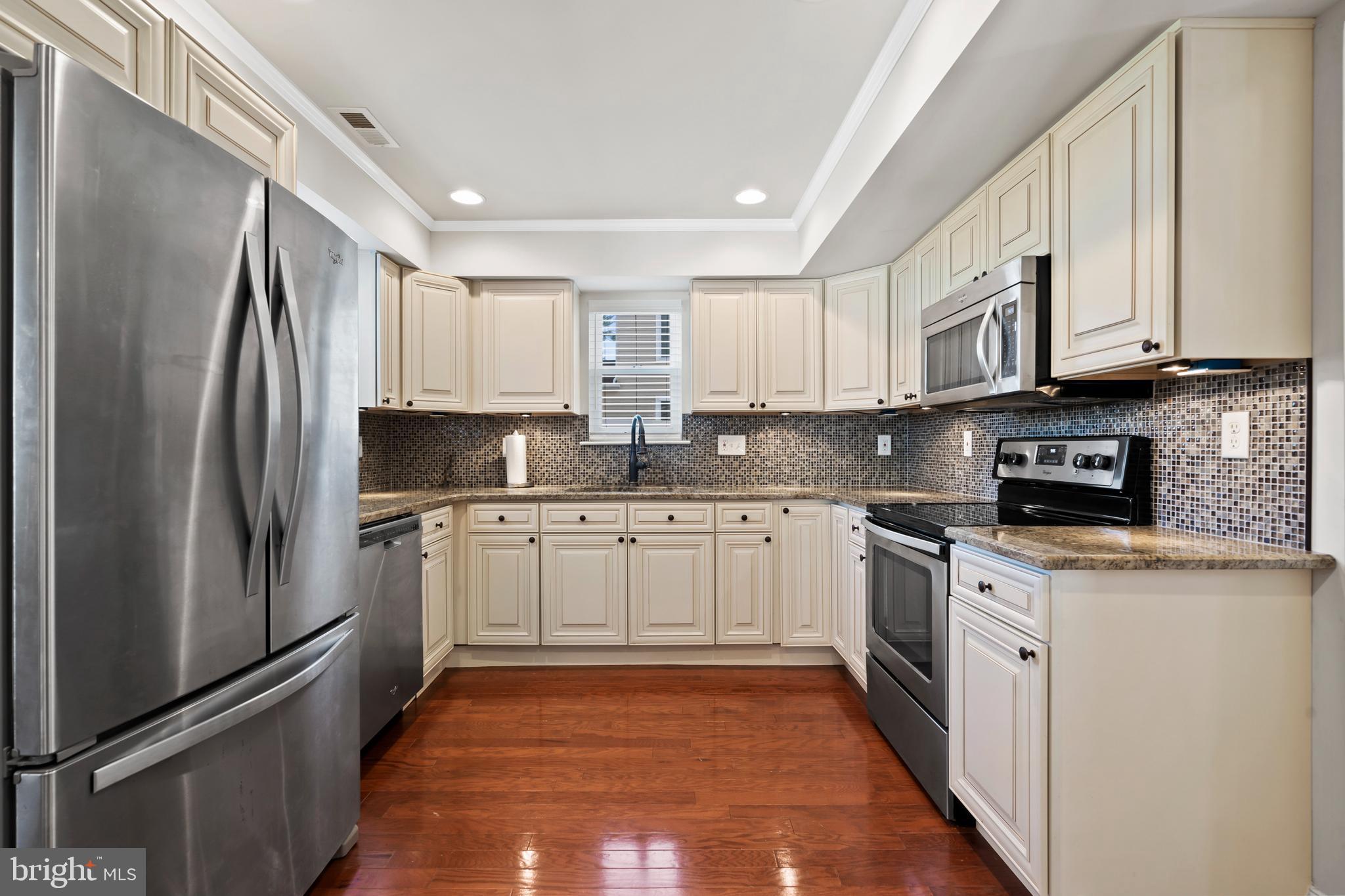 17 Alberts Way Langhorne, PA 19047 - Photo 9 of 35 a kitchen with stainless steel appliances granite countertop a refrigerator sink and stove