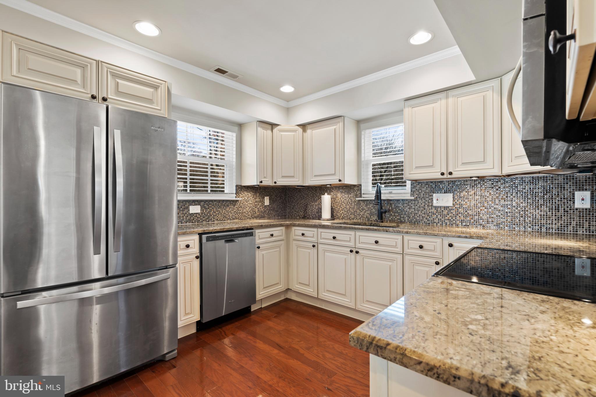 17 Alberts Way Langhorne, PA 19047 - Photo 10 of 35 a kitchen with granite countertop stainless steel appliances a refrigerator sink and microwave