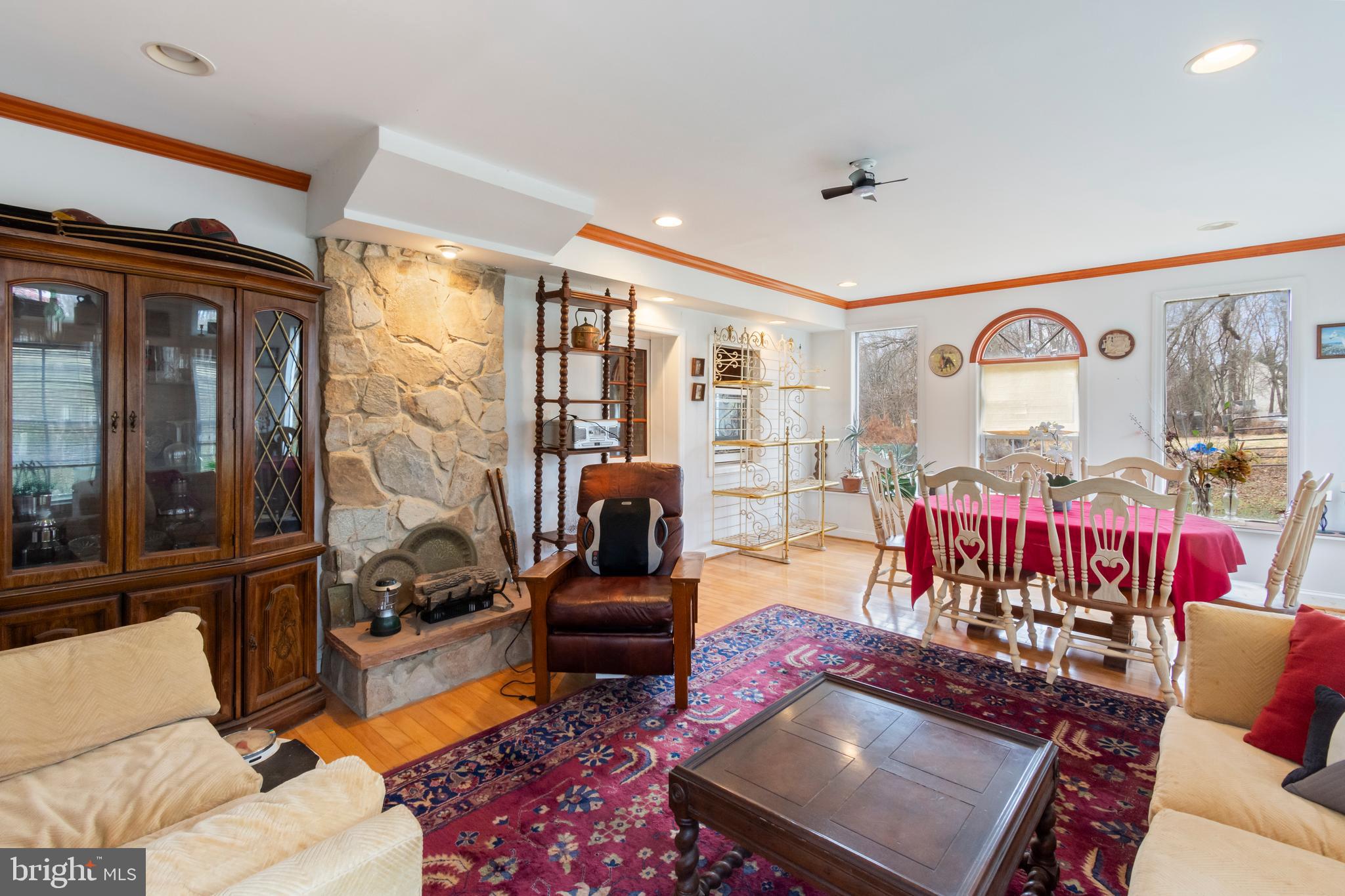 4047 Ridge Road Westminster, MD 21157 - Photo 23 of 112 a living room with furniture a rug and a chandelier