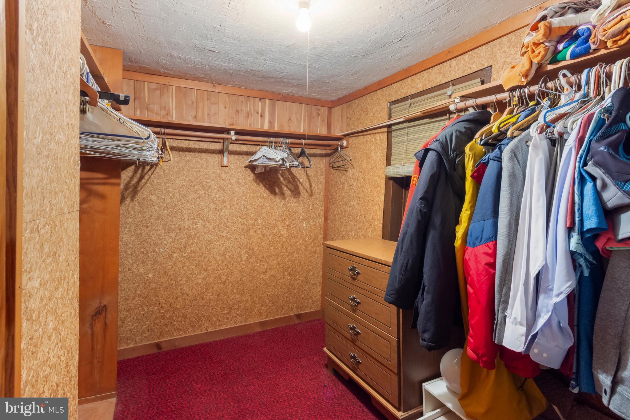 4047 Ridge Road Westminster, MD 21157 - Photo 40 of 112 a view of walk in closet with clothes and shoes