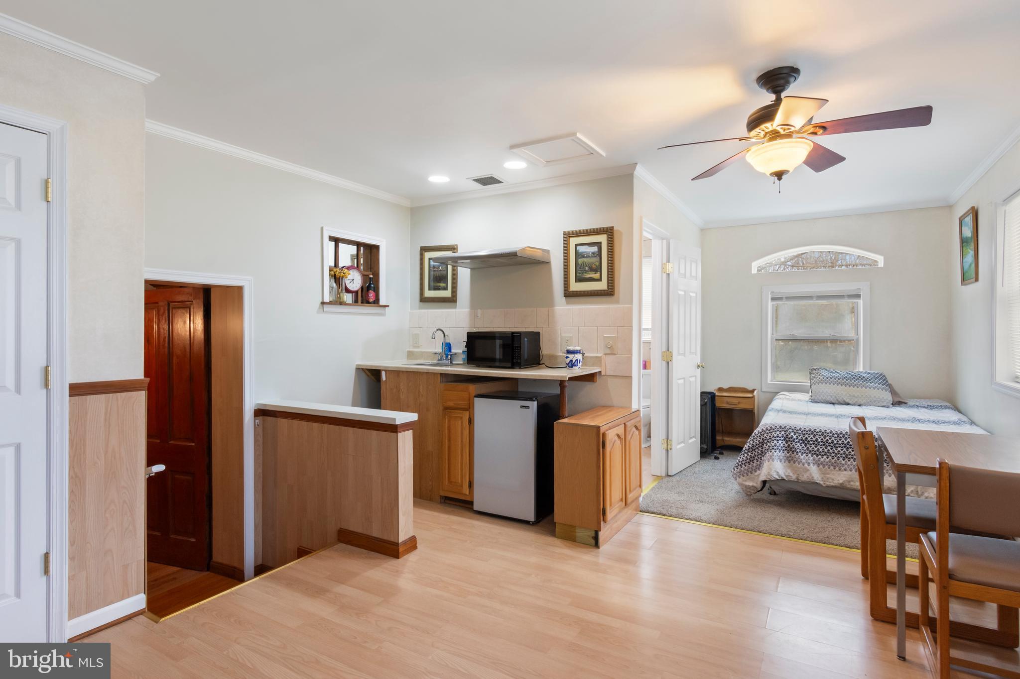 4047 Ridge Road Westminster, MD 21157 - Photo 45 of 112 a living room with furniture and a chandelier
