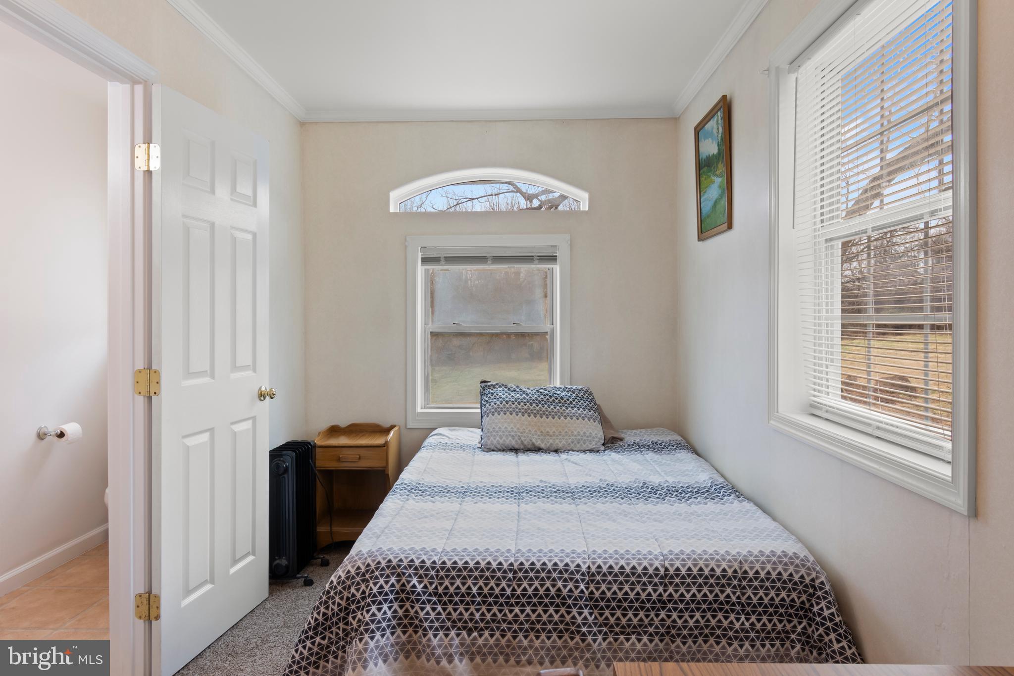 4047 Ridge Road Westminster, MD 21157 - Photo 48 of 112 a bedroom with a bed and a window
