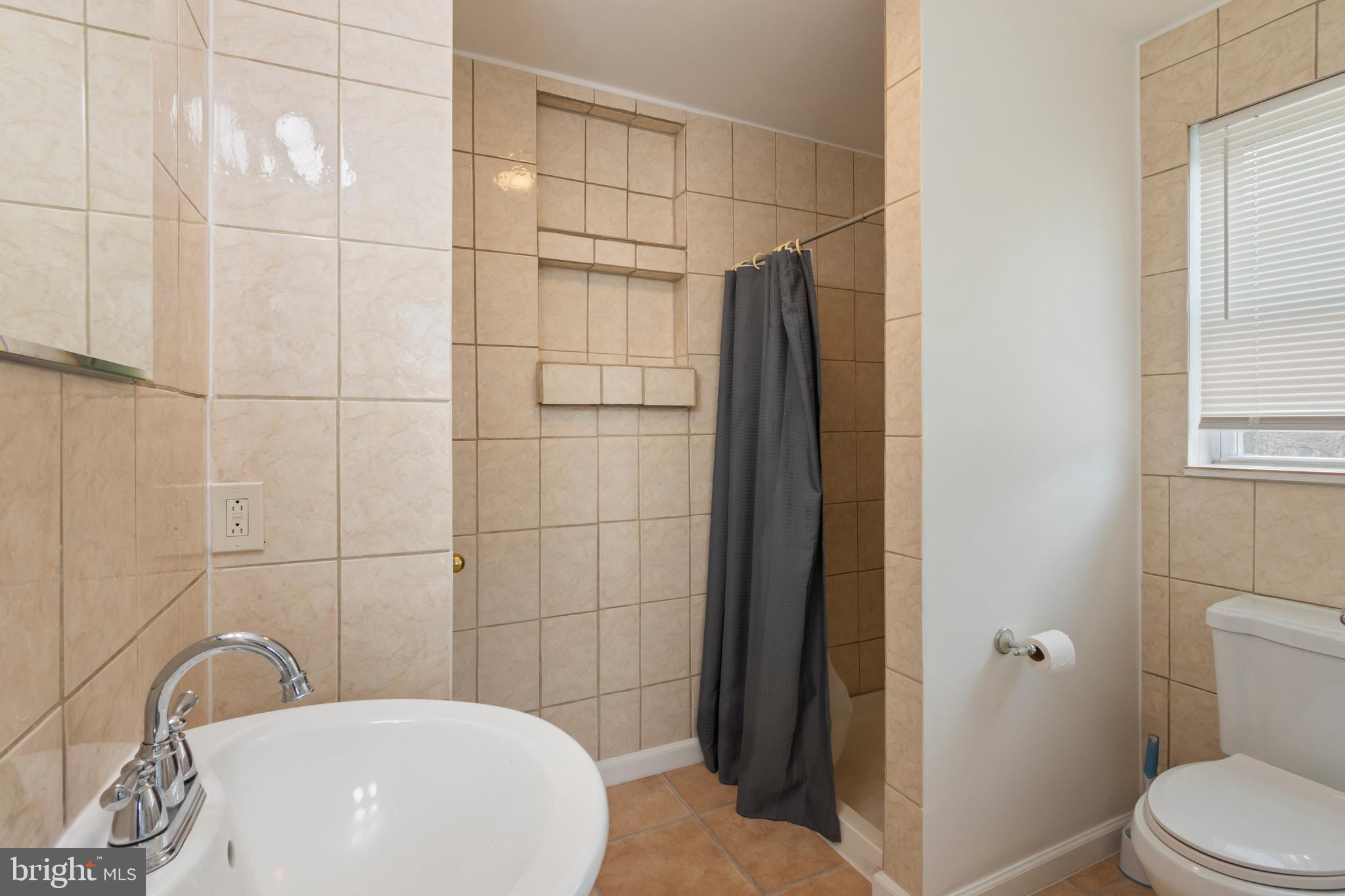 4047 Ridge Road Westminster, MD 21157 - Photo 49 of 112 a bathroom with a toilet and shower