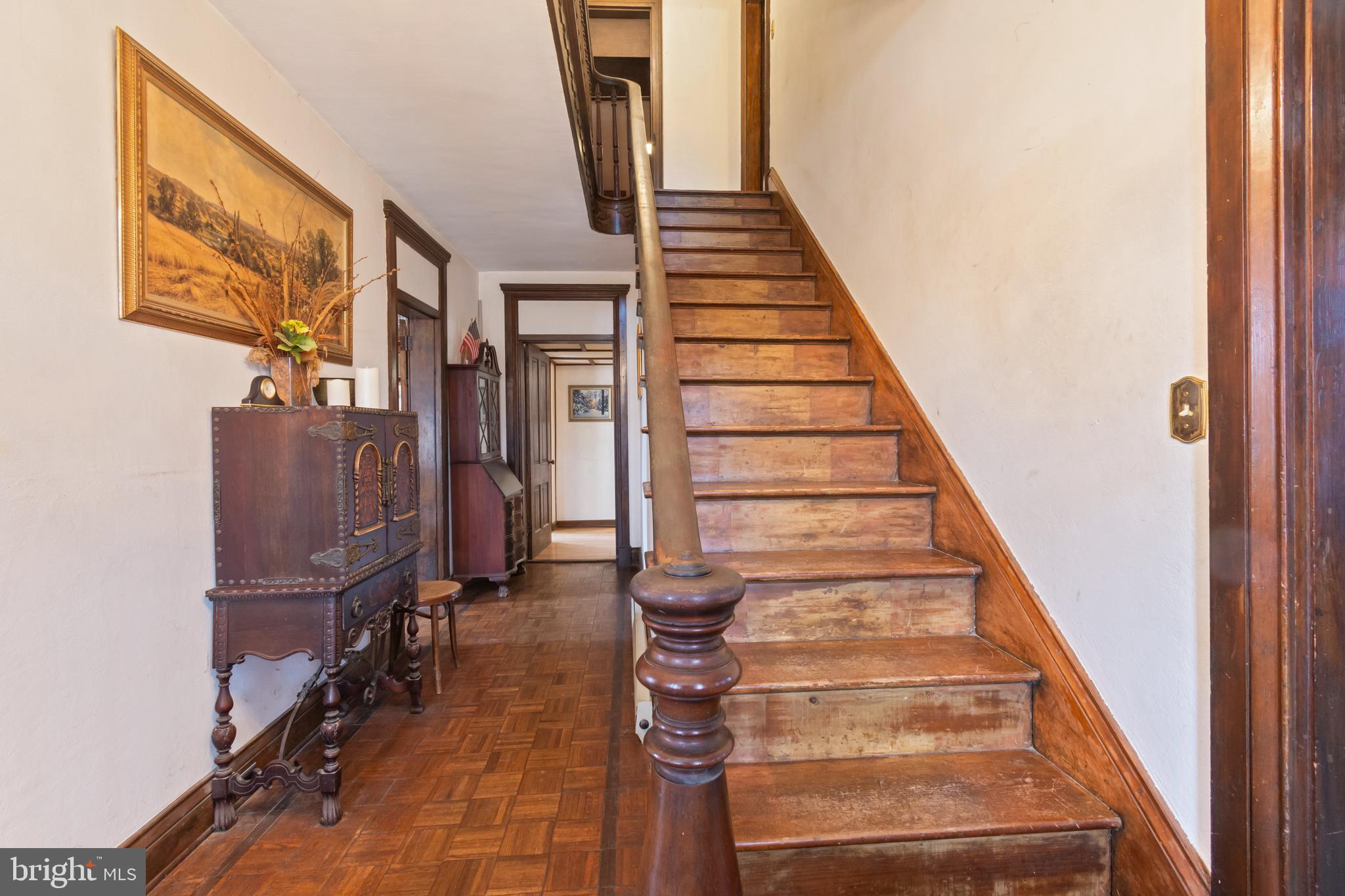 4047 Ridge Road Westminster, MD 21157 - Photo 7 of 112 a view of staircase with lots of frames on wall