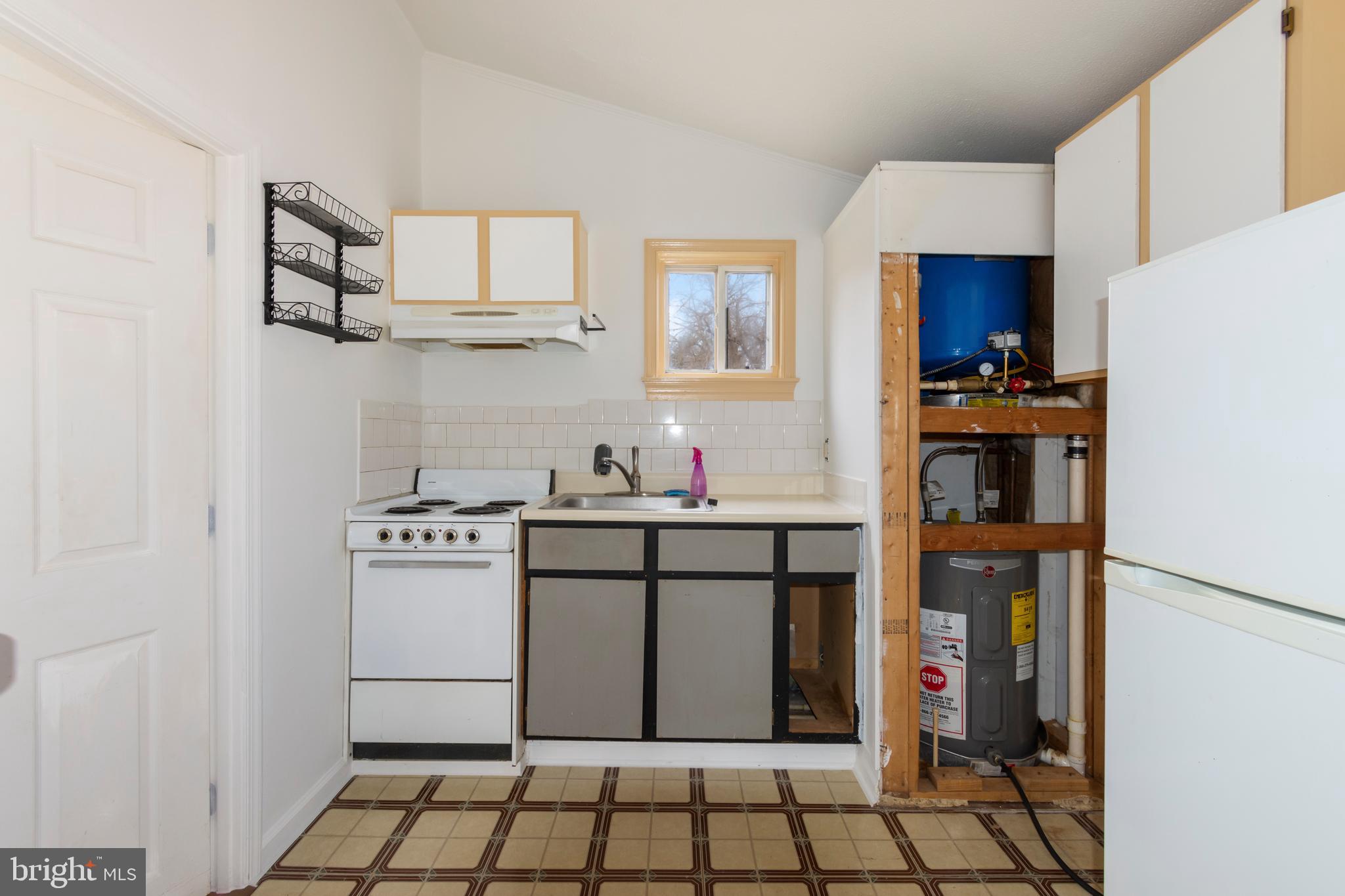 4047 Ridge Road Westminster, MD 21157 - Photo 90 of 112 a kitchen with stainless steel appliances granite countertop a sink stove and cabinets