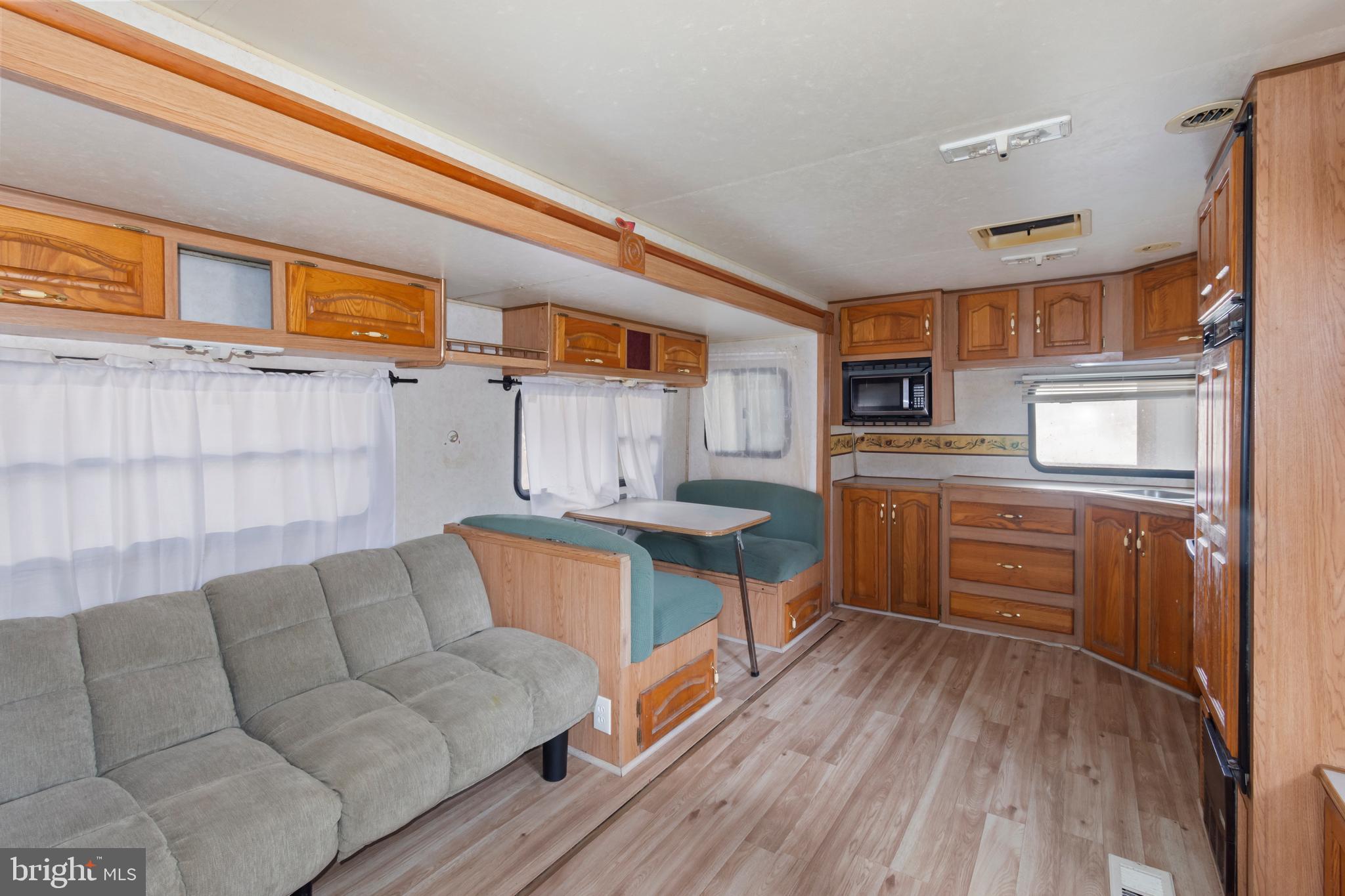 4047 Ridge Road Westminster, MD 21157 - Photo 95 of 112 a living room with furniture and a wooden floor
