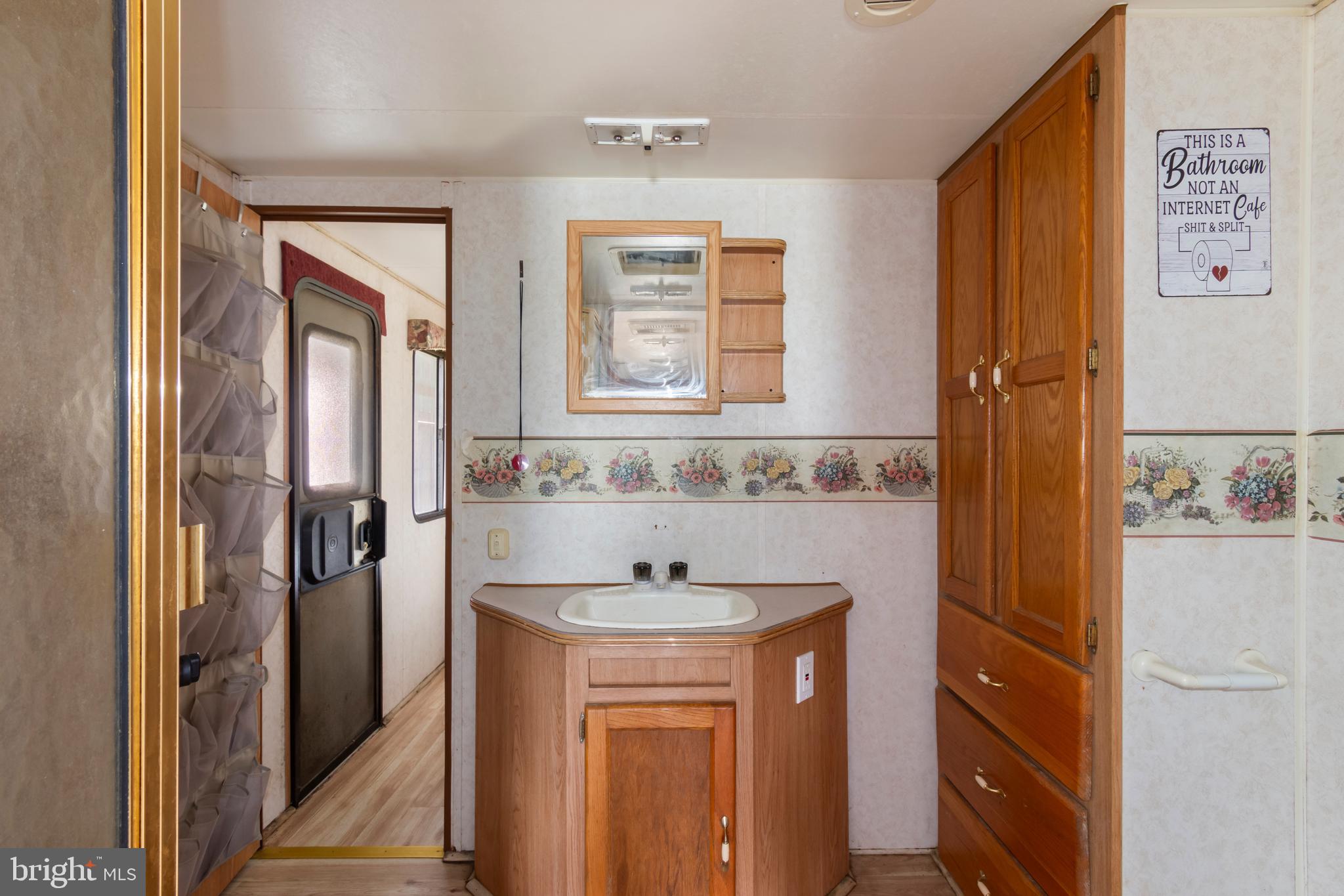 4047 Ridge Road Westminster, MD 21157 - Photo 97 of 112 a bathroom with a sink a mirror and shower
