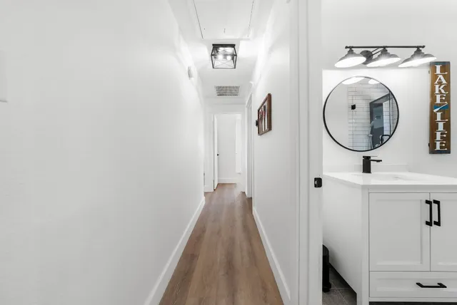 a view of a hallway with washer and dryer