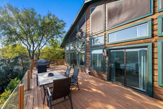 a view of a patio with table and chairs and potted plants