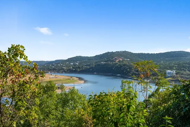 a view of a lake with mountains in the background