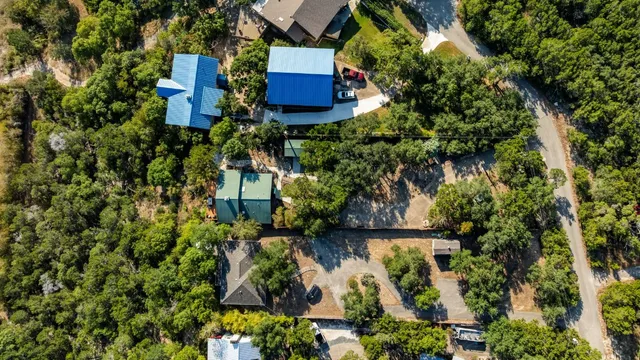 a view of a house with a tree in the background
