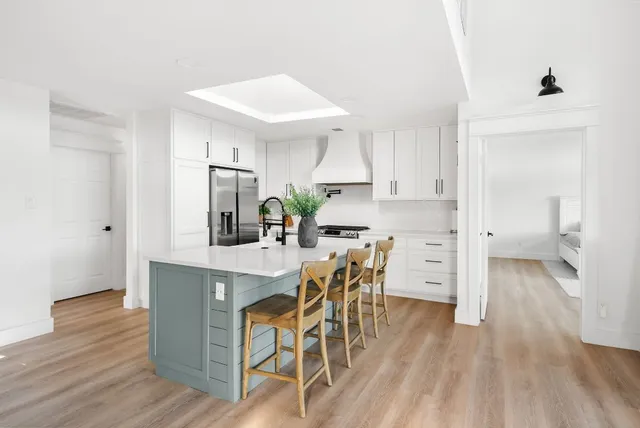 a kitchen with a table and chairs in it
