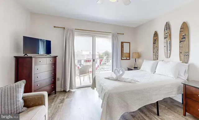 a bedroom with a bed and a television