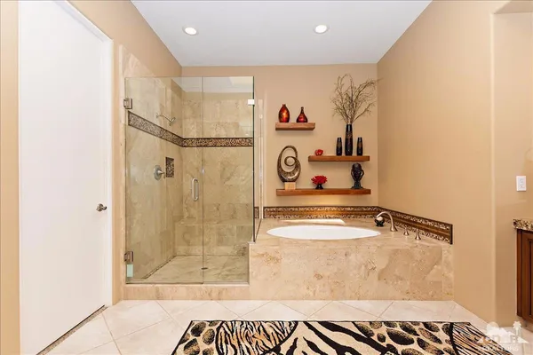 a bathroom with a tub and shower