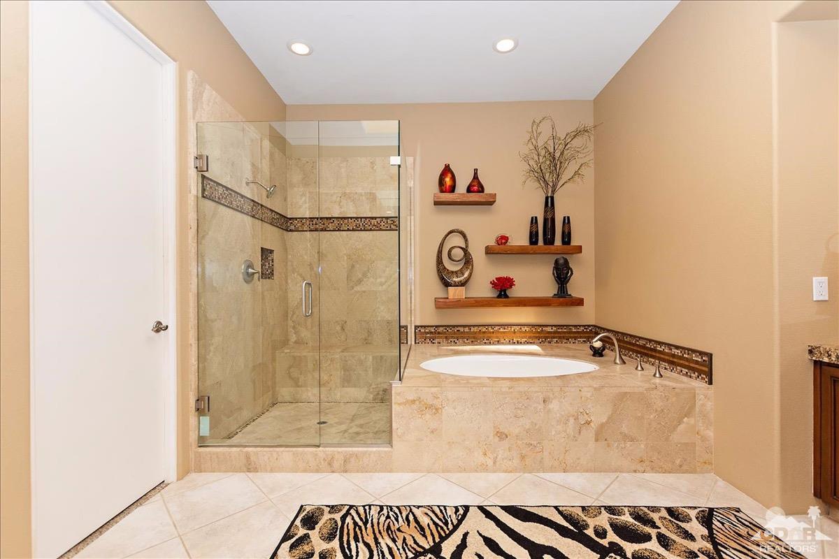 48010 Vía Vallarta La Quinta, CA 92253 - Photo 14 of 37 a bathroom with a tub and shower