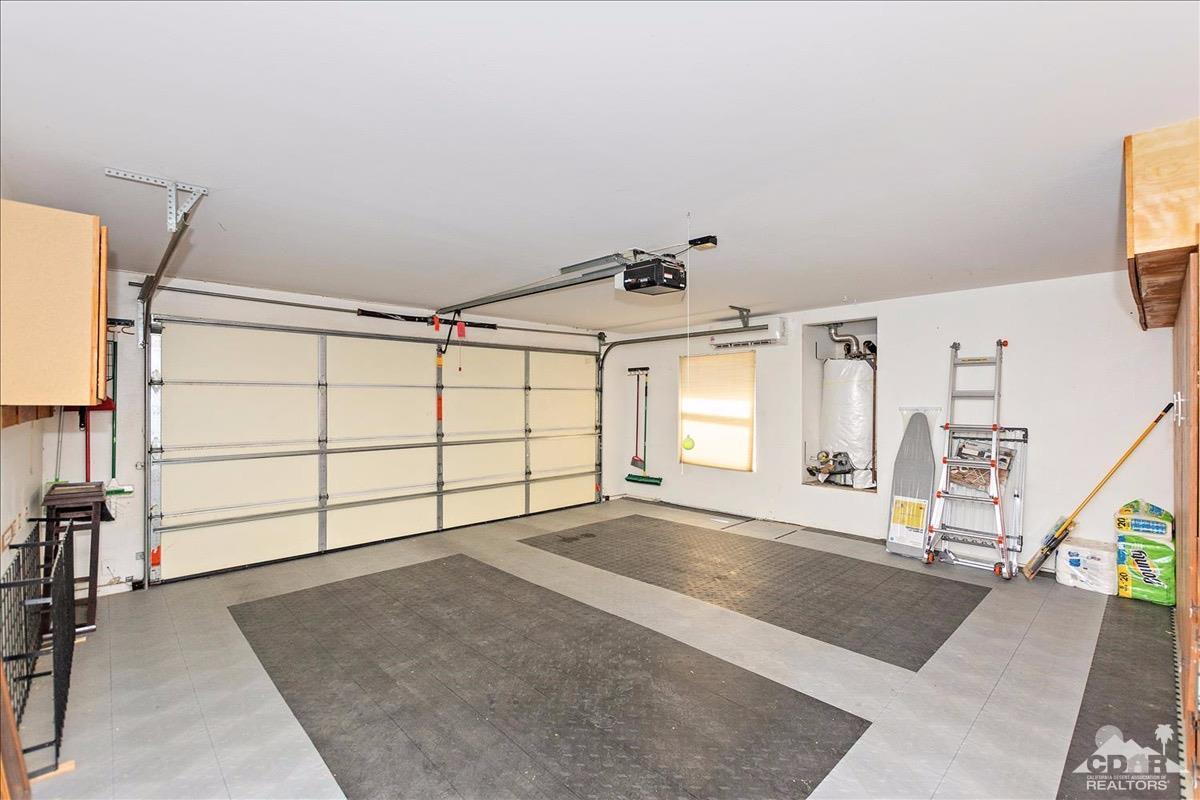 48010 Vía Vallarta La Quinta, CA 92253 - Photo 22 of 37 a view of a livingroom with a staircase