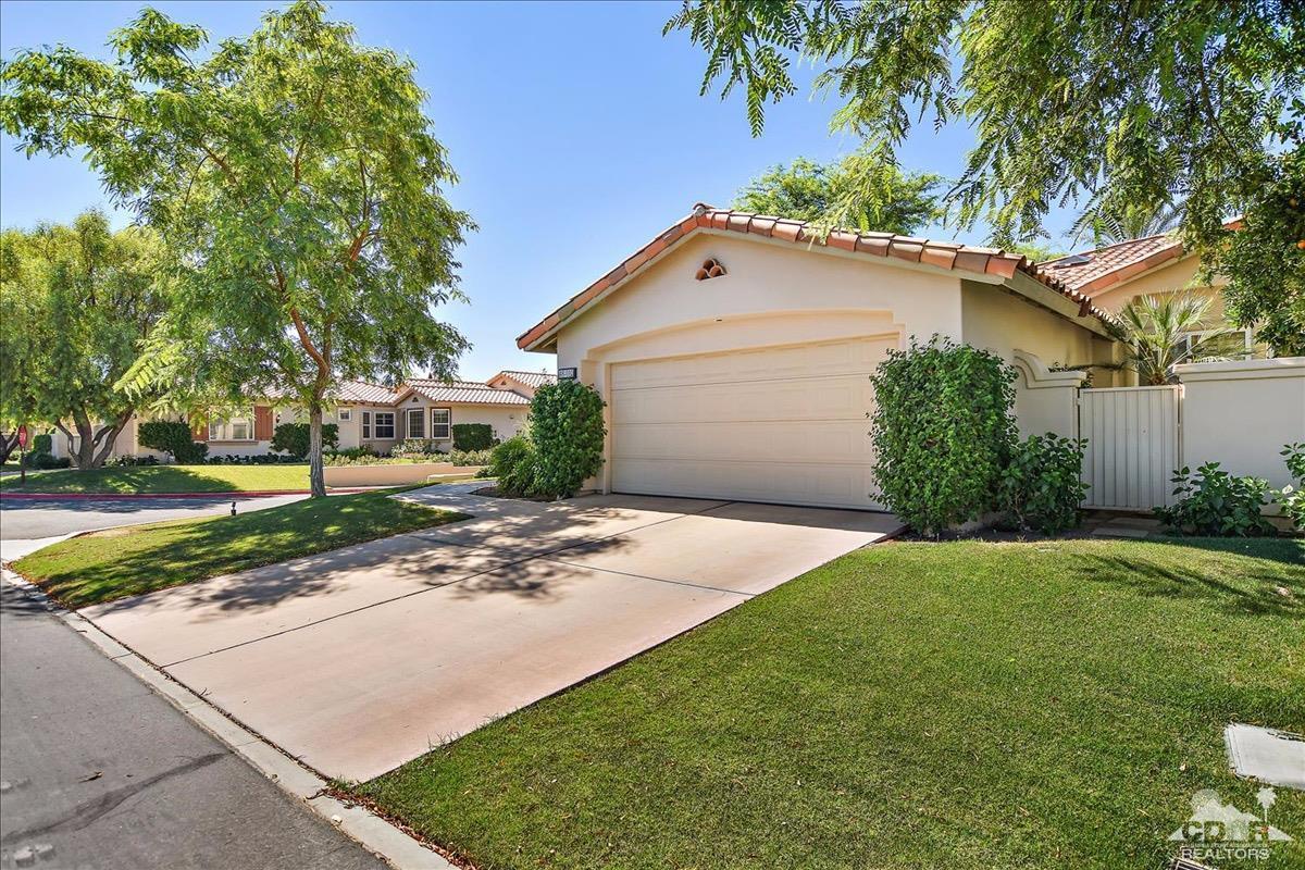 48010 Vía Vallarta La Quinta, CA 92253 - Photo 29 of 37 a front view of a house with a yard and garage