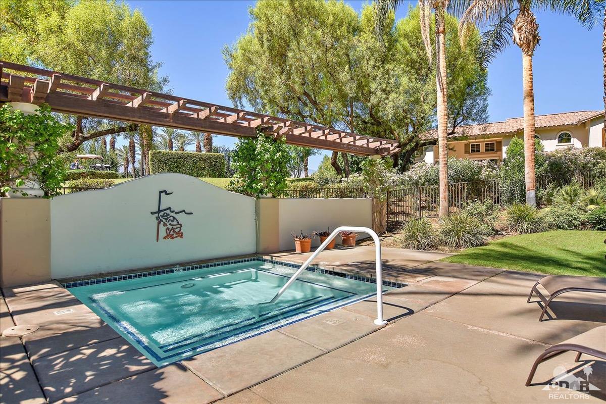 48010 Vía Vallarta La Quinta, CA 92253 - Photo 33 of 37 a backyard of a house with a table and chair