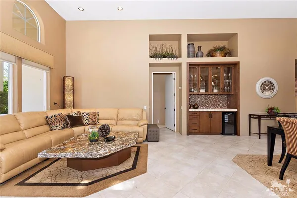 a living room with furniture and a table
