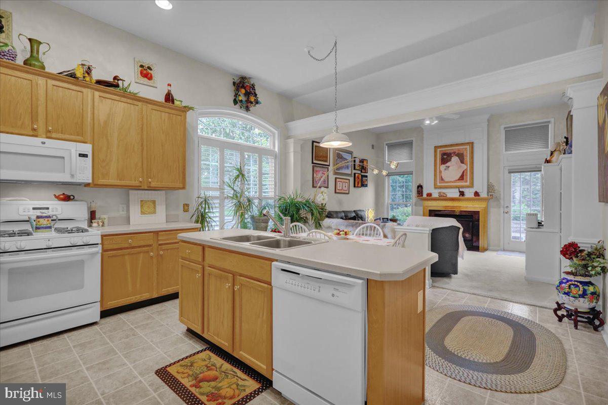 213 Aster Circle Kennett Square, PA 19348 - Photo 14 of 39 a kitchen with sink stove and cabinets