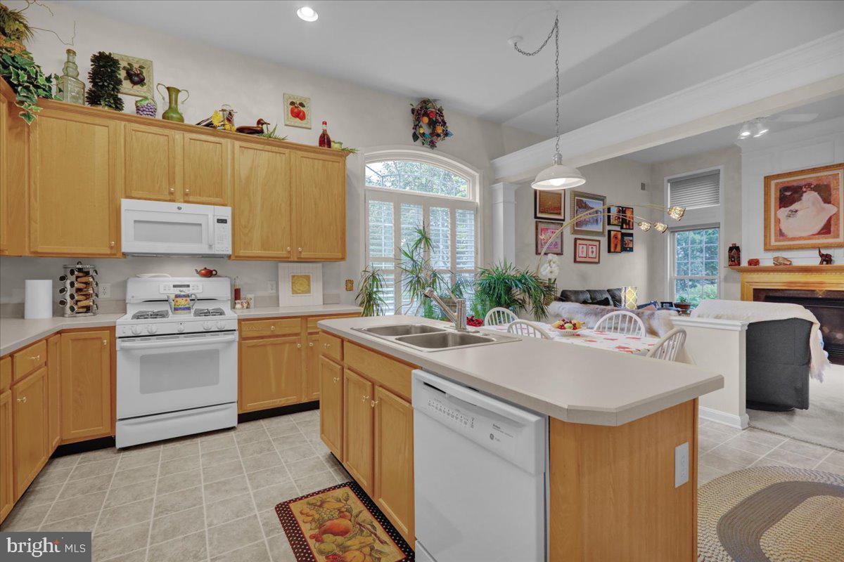 213 Aster Circle Kennett Square, PA 19348 - Photo 15 of 39 a kitchen that has a sink and a stove in it