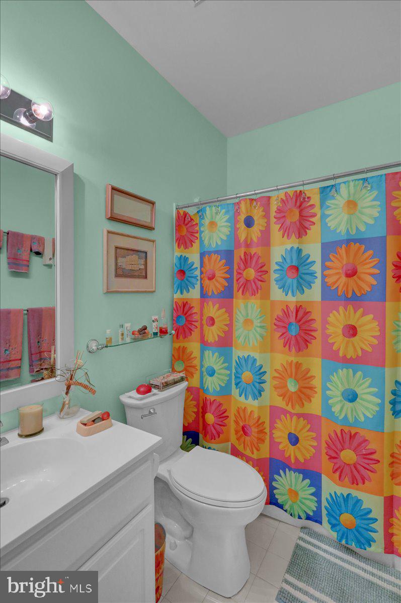 213 Aster Circle Kennett Square, PA 19348 - Photo 23 of 39 a white bath tub sitting next to a white sink and a toilet