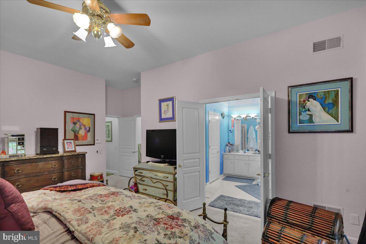 213 Aster Circle Kennett Square, PA 19348 - Photo 25 of 39 a bedroom with a bed and a flat screen tv