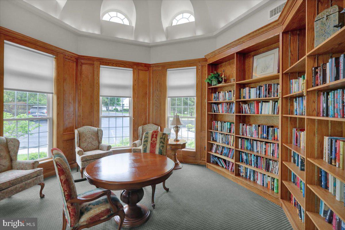 213 Aster Circle Kennett Square, PA 19348 - Photo 35 of 39 a view of a livingroom with furniture and a book shelf
