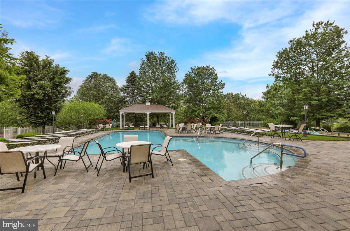 213 Aster Circle Kennett Square, PA 19348 - Photo 36 of 39 a view of a swimming pool with chairs in roof deck